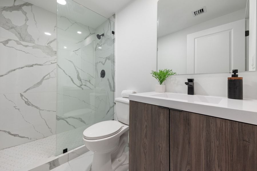 Representative furnished interior of a home built from the Model E by Onx Homes in On Alba, Florida City (Image 44).