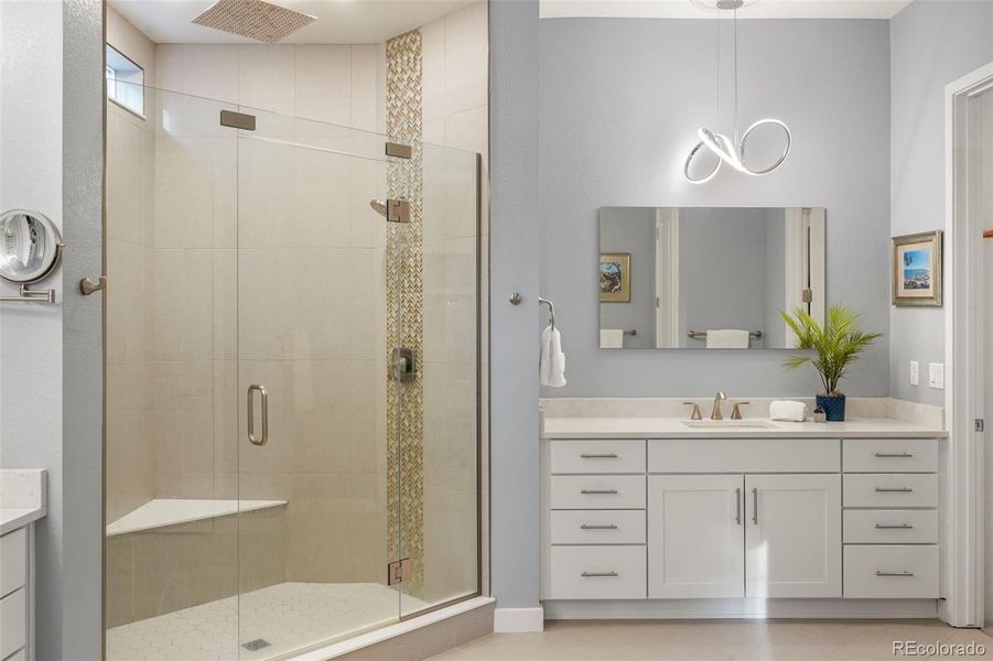 Primary bathroom with upgraded ligthing and dual vanities