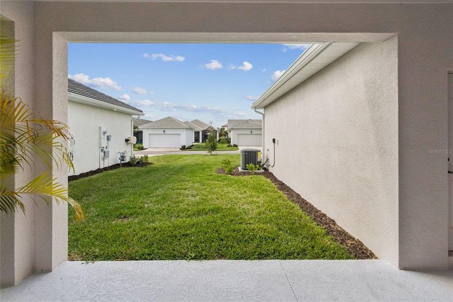 Exterior details and patio area of a home in Vistera of Venice – Cottage Series, Nokomis (Image 4).