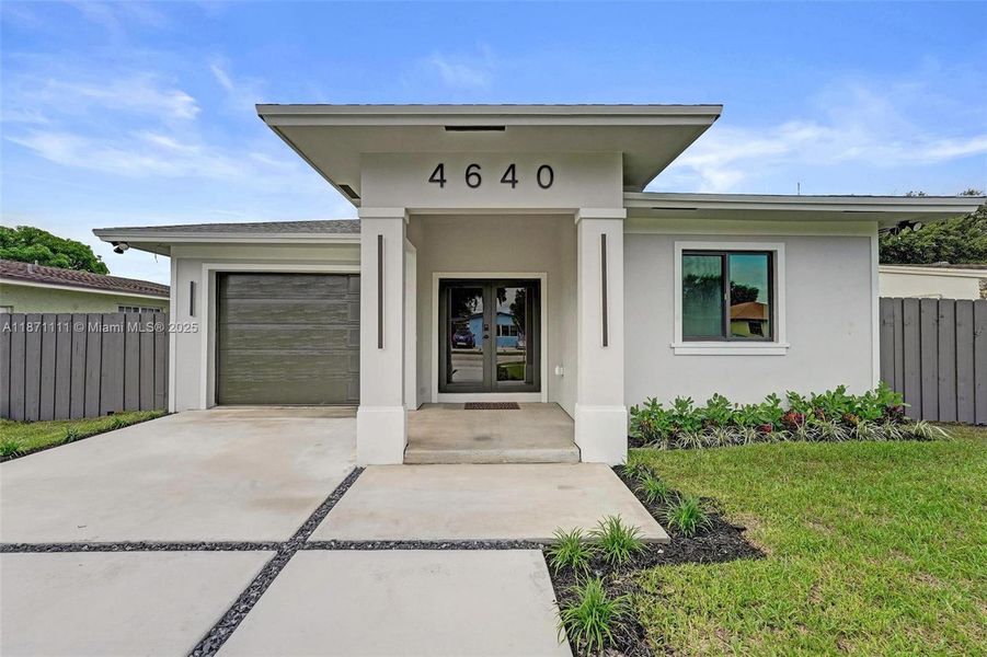 Front exterior of a new home in , West Park, FL, highlighting curb appeal (Image 27). Front exterior of a new home in , West Park, FL, highlighting curb appeal (Image 27).
