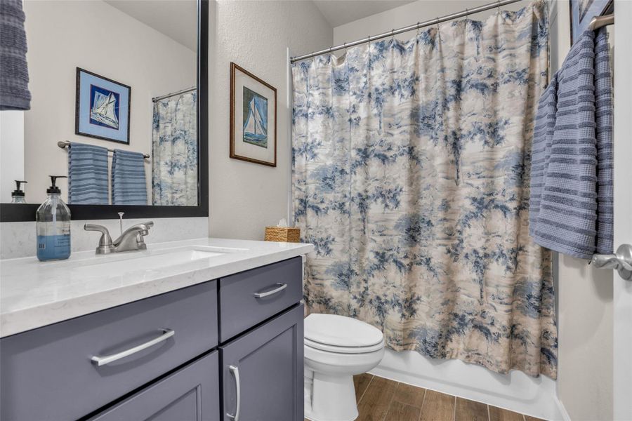 Secondary bathroom off the hallway. Secondary bathroom off the hallway.