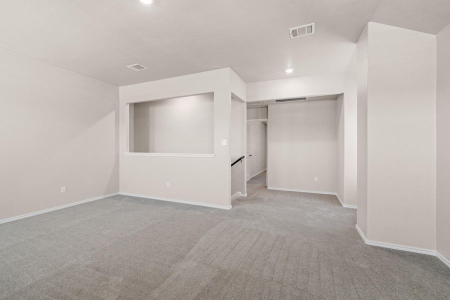 Unfurnished bedroom featuring light carpet and recessed lighting