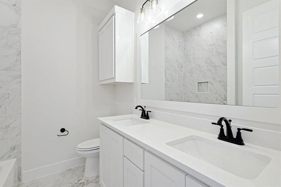 Bathroom with toilet and vanity