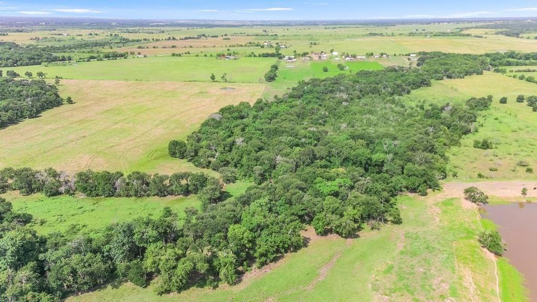 Aerial view of sparsely populated area with a nearby body of water Aerial view of sparsely populated area with a nearby body of water
