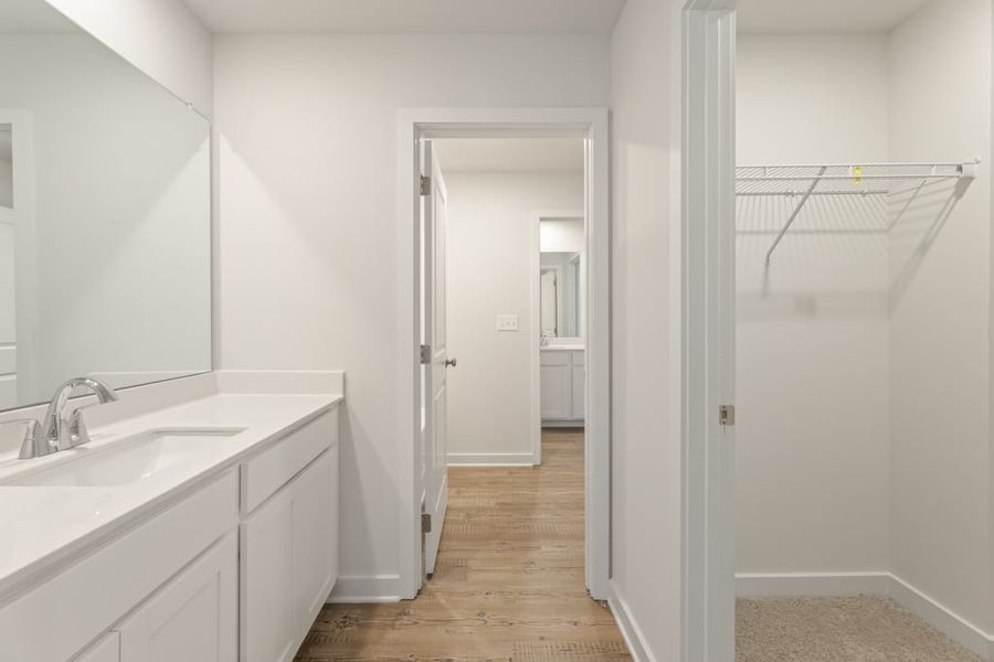 A bathroom with white walls.