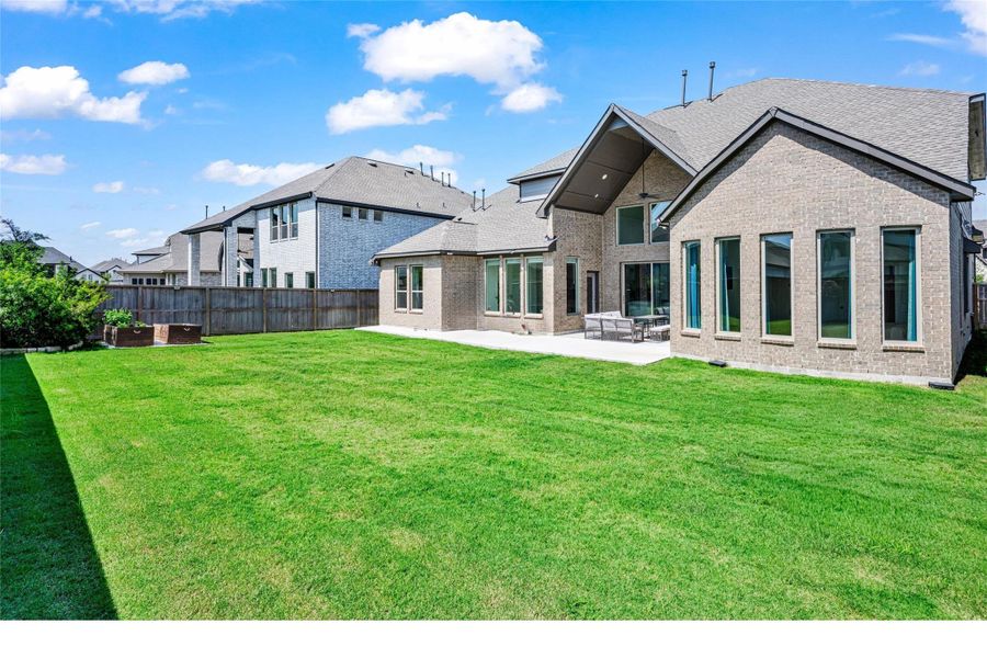 Exterior details and patio area of a home in Dunham Pointe, Cypress (Image 25).