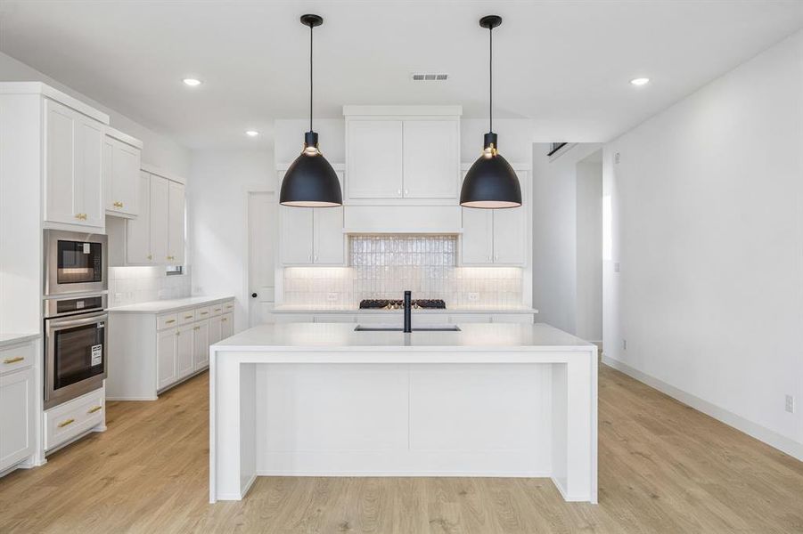 Your new island is the centerpiece of this dream kitchen and the perfect gathering place for family and friends.