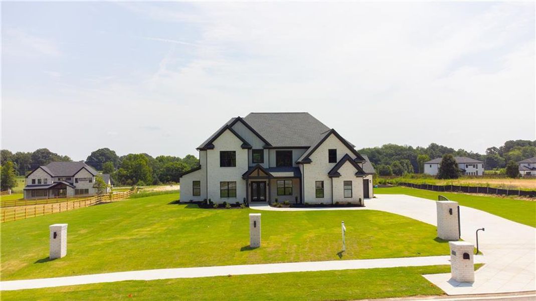 Front exterior of a new home in , Dacula, GA, highlighting curb appeal (Image 2). Front exterior of a new home in , Dacula, GA, highlighting curb appeal (Image 2).