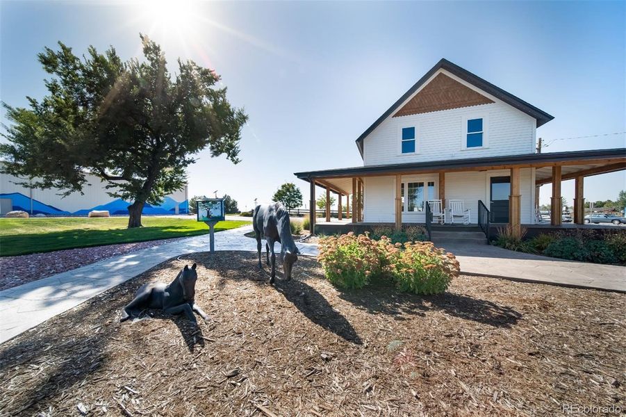 Front exterior of a new home in Muegge Farms, Bennett, CO, highlighting curb appeal (Image 1). Front exterior of a new home in Muegge Farms, Bennett, CO, highlighting curb appeal (Image 1).
