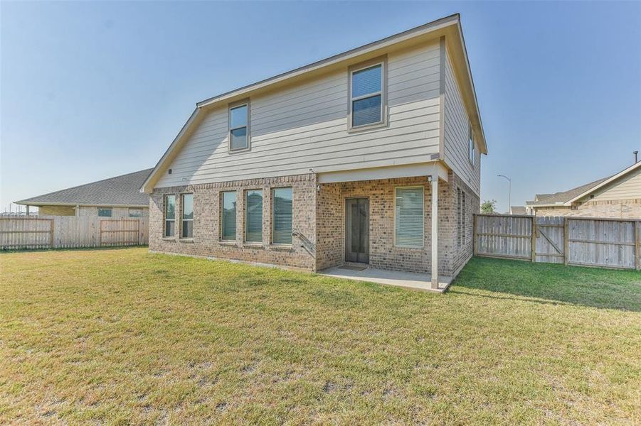 Another view of your patio and immense  backyard space.