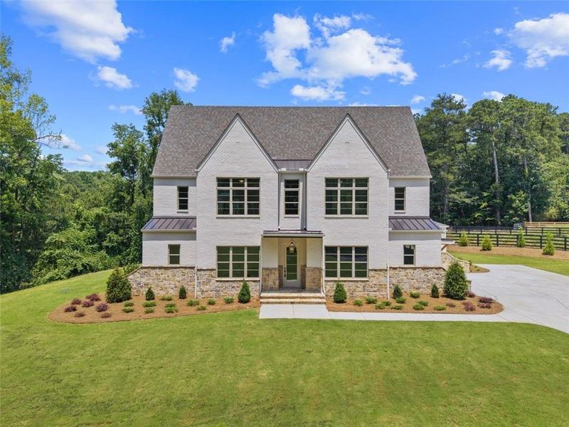 Front exterior of a new home in , Alpharetta, GA, highlighting curb appeal (Image 32). Front exterior of a new home in , Alpharetta, GA, highlighting curb appeal (Image 32).