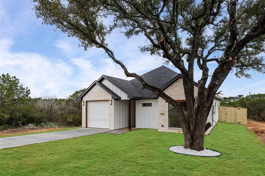 Front exterior of a new home in , Granbury, TX, highlighting curb appeal (Image 21).