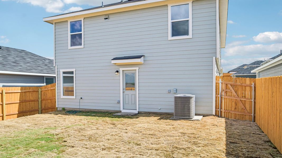 Exterior details and patio area of a home in Prairie Lakes, Buda (Image 4).