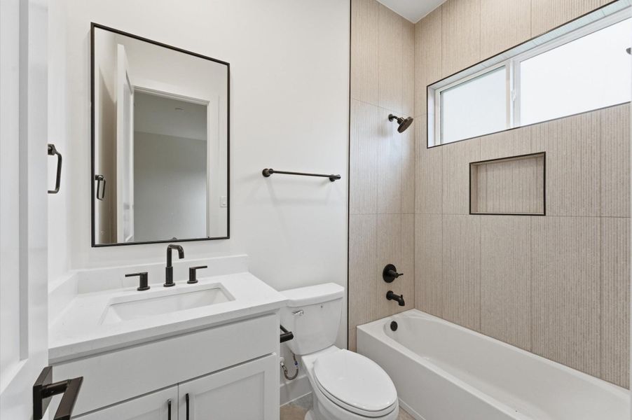 Full bathroom on the second floor is accessible from the bedroom.