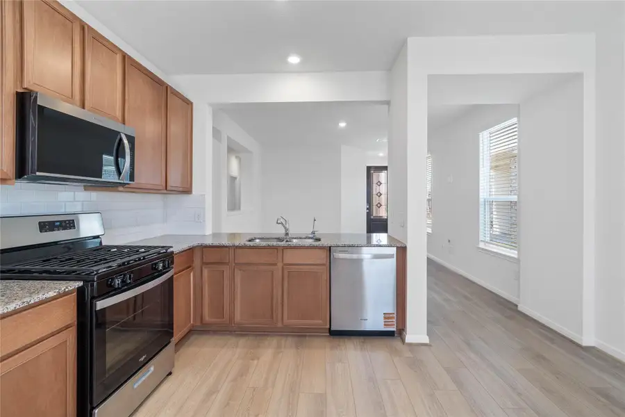 Another perspective of this beautiful kitchen and its open views of the Great Room and entryway! Another perspective of this beautiful kitchen and its open views of the Great Room and entryway!