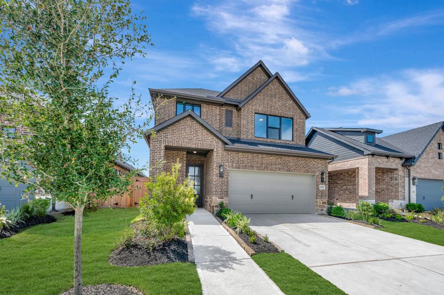 Front exterior of a new home in Sienna - Grove Collection, Missouri City, TX, highlighting curb appeal (Image 22).