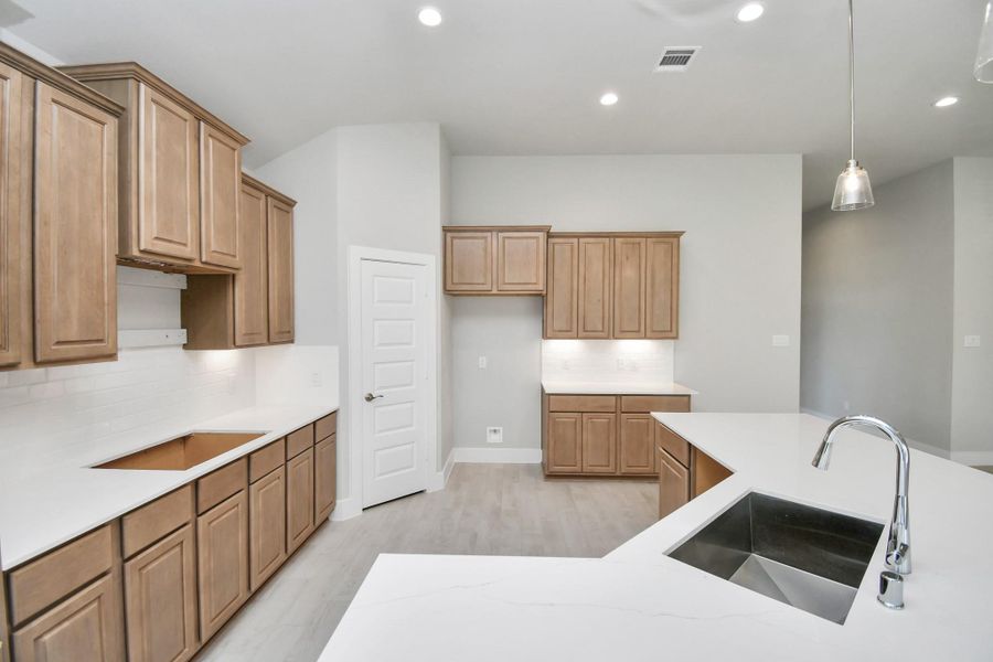 The extended counter area adds both practicality and style, making meal preparation a breeze. Every detail is thoughtfully designed to enhance the kitchen's functionality and aesthetic appeal. The extended counter area adds both practicality and style, making meal preparation a breeze. Every detail is thoughtfully designed to enhance the kitchen's functionality and aesthetic appeal.