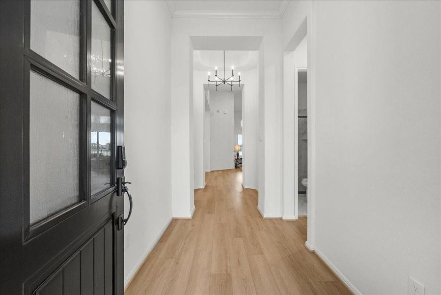 Enter through the covered front porch into soaring high ceilings and an inviting open-concept design.