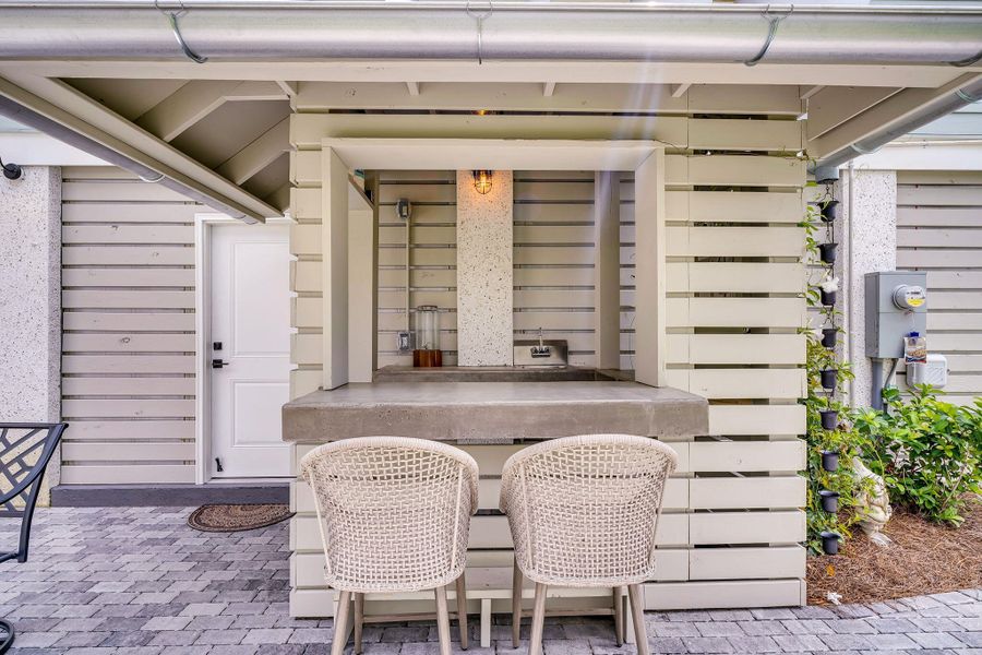 Exterior details and patio area of a home in Overlook at Copahee Sound, Awendaw (Image 36).