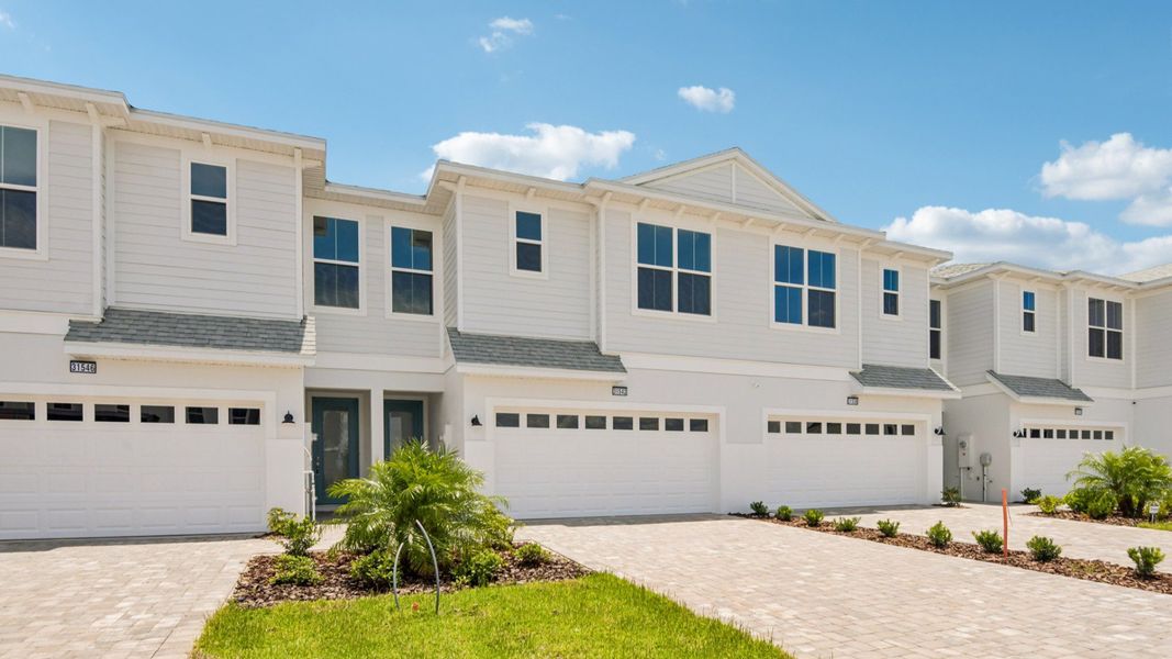 Front exterior of a new home in Isla Mirada, San Antonio, FL, highlighting curb appeal (Image 2). Front exterior of a new home in Isla Mirada, San Antonio, FL, highlighting curb appeal (Image 2).