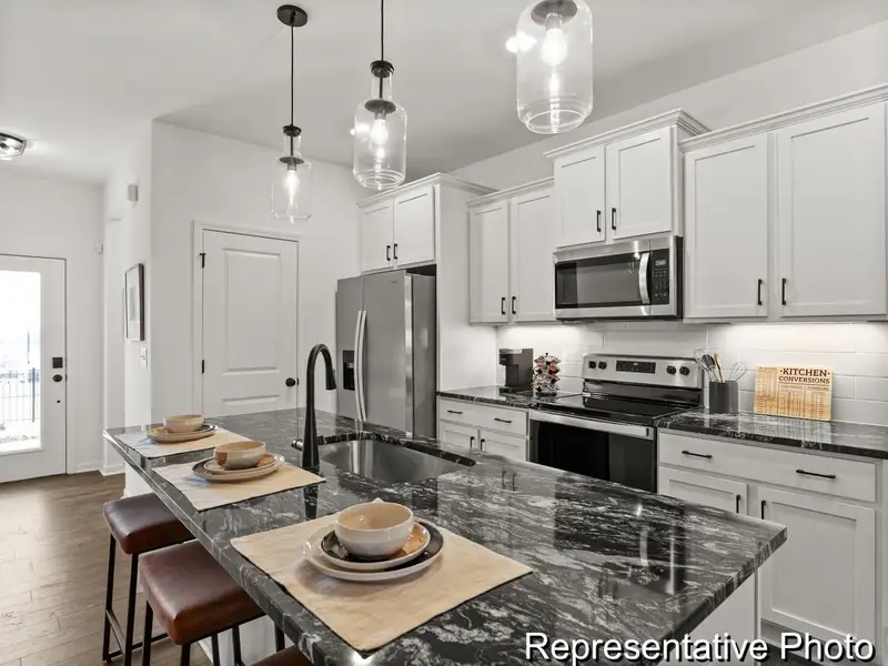 Furnished interior view inside a new home in North District at Flowers Plantation Townhomes, Clayton (Image 2). Furnished interior view inside a new home in North District at Flowers Plantation Townhomes, Clayton (Image 2).
