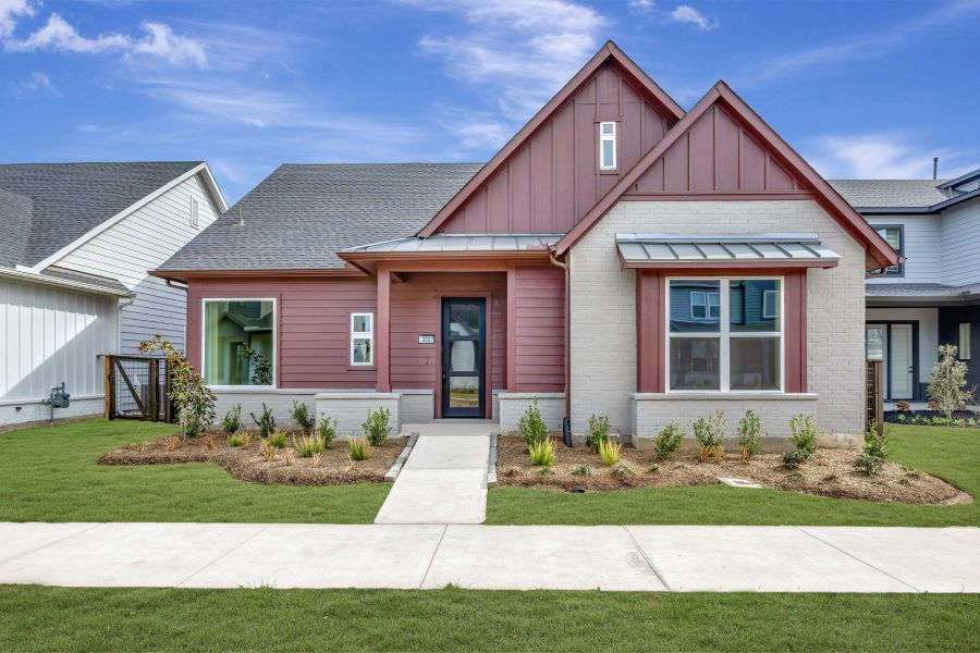Front exterior of a new home in Indigo - Enclave Collection, Richmond, TX, highlighting curb appeal (Image 2). Front exterior of a new home in Indigo - Enclave Collection, Richmond, TX, highlighting curb appeal (Image 2).