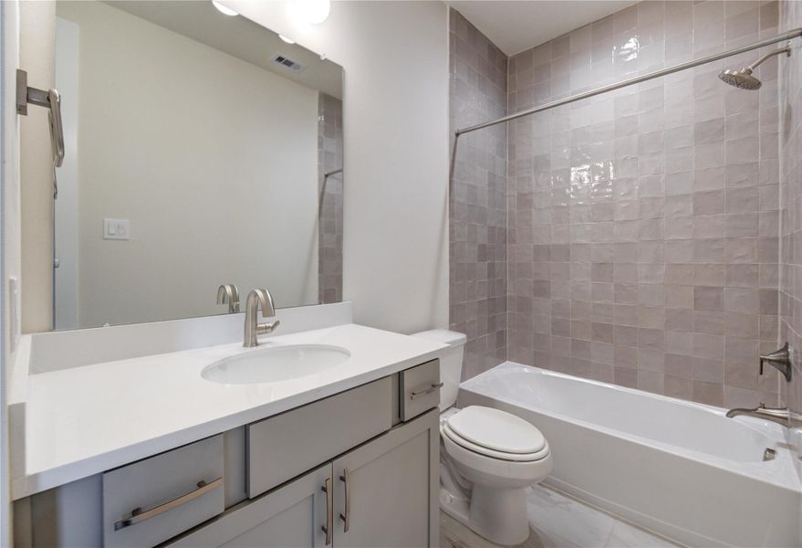 One of the two secondary bathrooms on the second floor