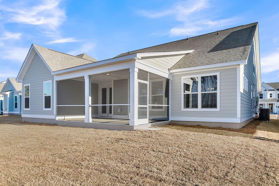 Exterior details and patio area of a home in Tidewater at Lakes of Cane Bay, Summerville (Image 3).