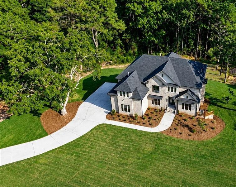 Front exterior of a new home in , Loganville, GA, highlighting curb appeal (Image 22).