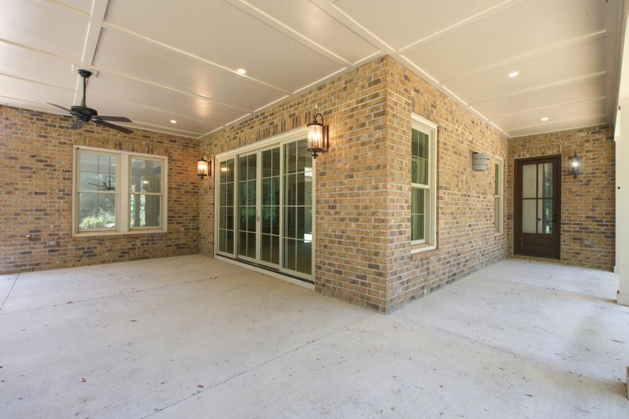 Exterior details and patio area of a home in , Johns Island (Image 31).
