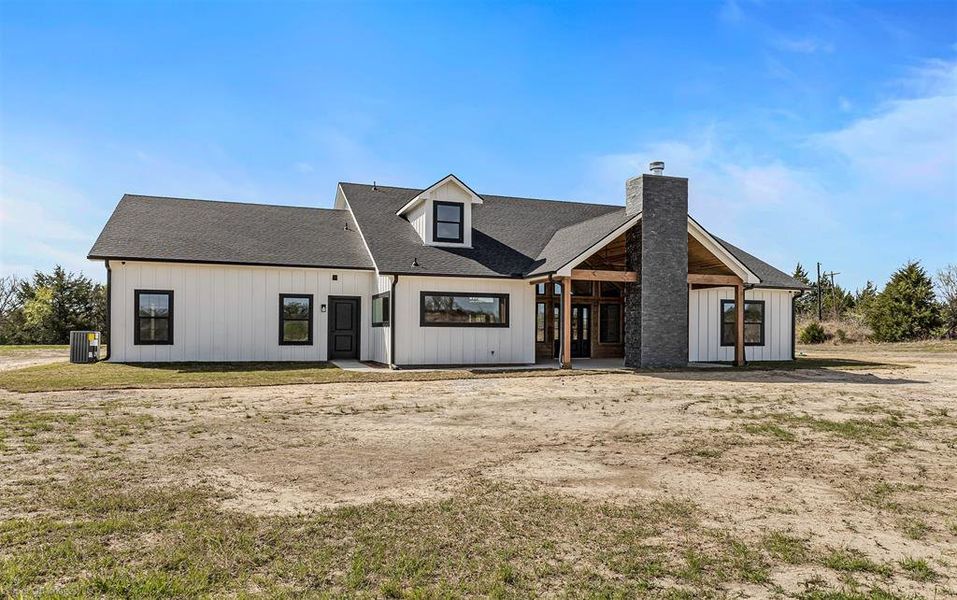 Front exterior of a new home in , Quinlan, TX, highlighting curb appeal (Image 21).