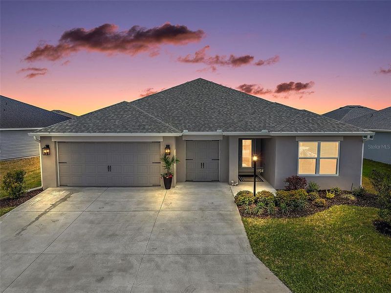 Front exterior of a new home in , The Villages, FL, highlighting curb appeal (Image 1). Front exterior of a new home in , The Villages, FL, highlighting curb appeal (Image 1).