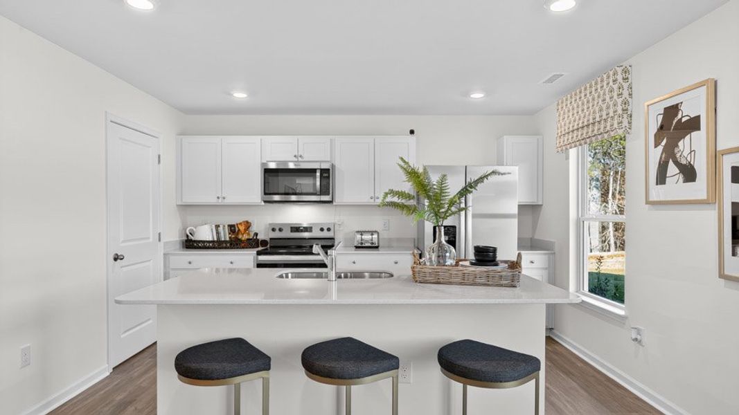 Representative furnished interior of a home built from the Penwell by D.R. Horton in Mangum Farms, Stem (Image 8).