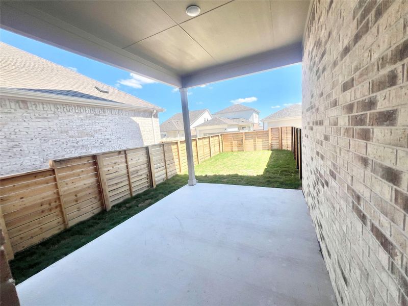 Fenced backyard featuring a patio area