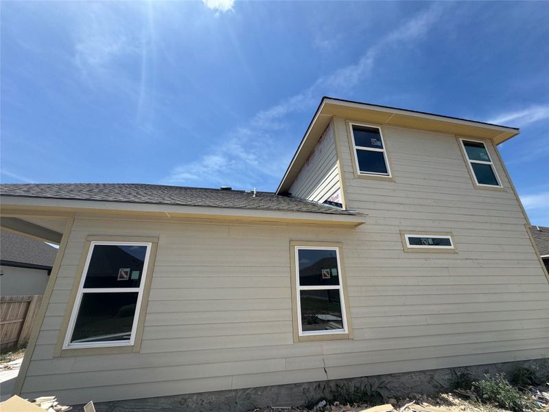 Front exterior of a new home in Village at Three Oaks, Seguin, TX, highlighting curb appeal (Image 10).
