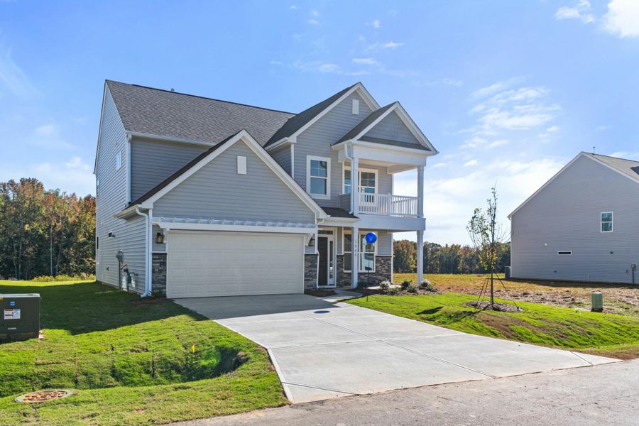 Front exterior of a new home in Monterra, Kernersville, NC, highlighting curb appeal (Image 22).