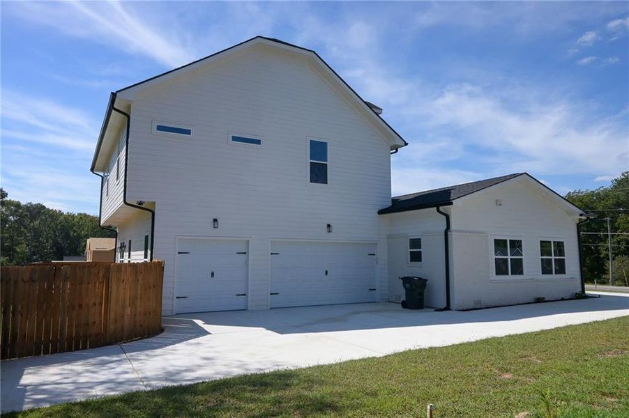 Front exterior of a new home in , Loganville, GA, highlighting curb appeal (Image 31).