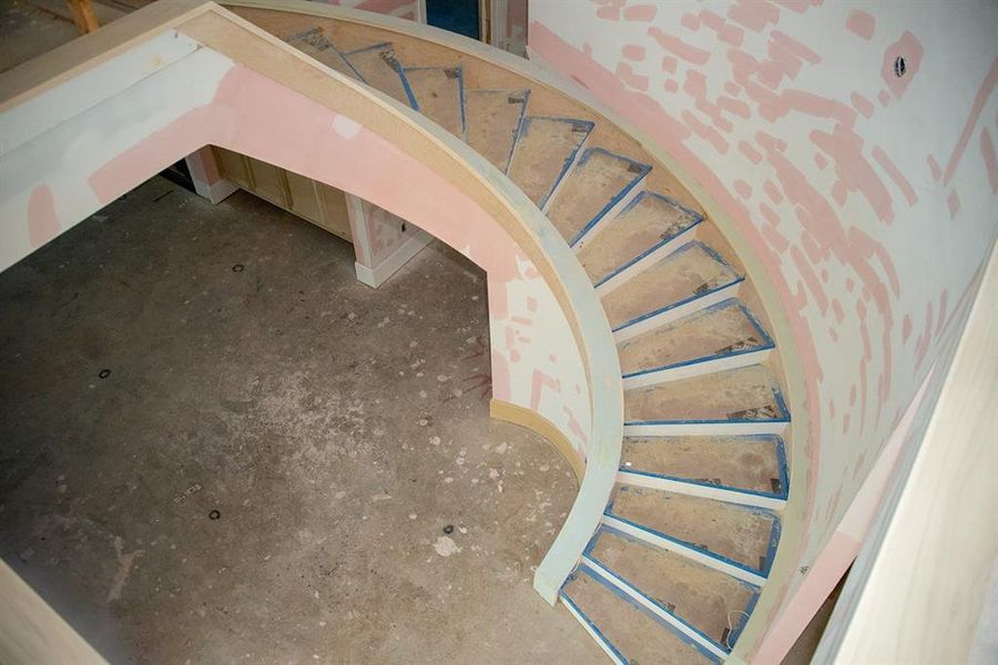 Show stopping spiral staircase with white oak steps, adding timeless beauty