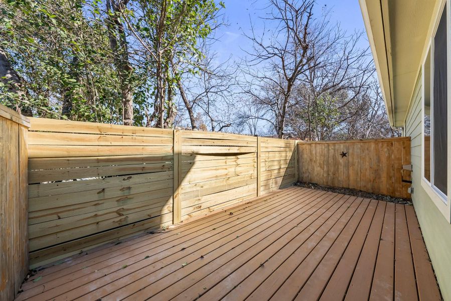 Fenced in deck on the back of the ADU offers a private outdoor space.