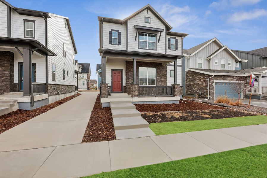 Front exterior of a new home in Painted Prairie Cottage, Aurora, CO, highlighting curb appeal (Image 24).
