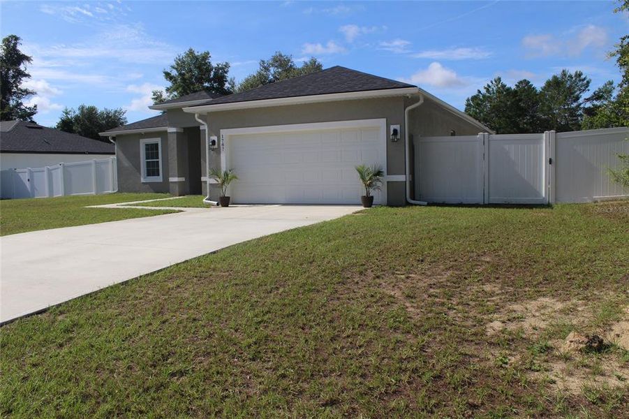 Front exterior of a new home in , Ocala, FL, highlighting curb appeal (Image 2). Front exterior of a new home in , Ocala, FL, highlighting curb appeal (Image 2).