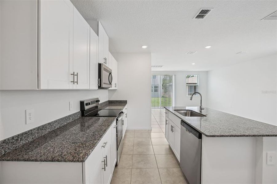 Furnished interior view inside a new home in Villamar - Classic Series, Winter Haven (Image 6).