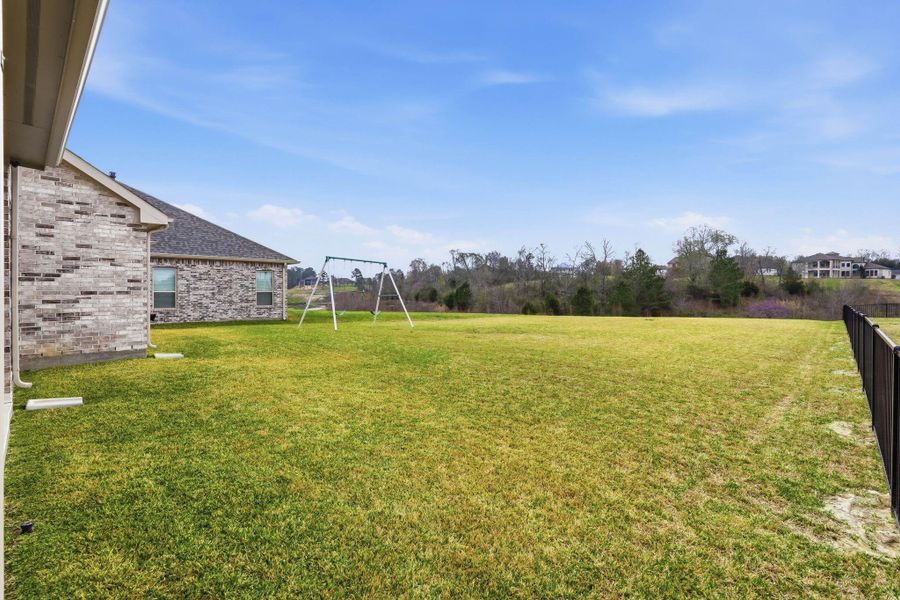 Exterior details and patio area of a home in Waterstone on Lake Conroe, Montgomery (Image 26).
