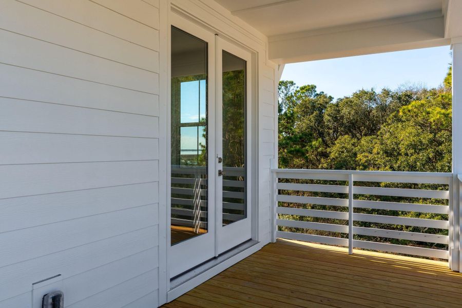 Exterior details and patio area of a home in Overlook at Copahee Sound, Awendaw (Image 40).
