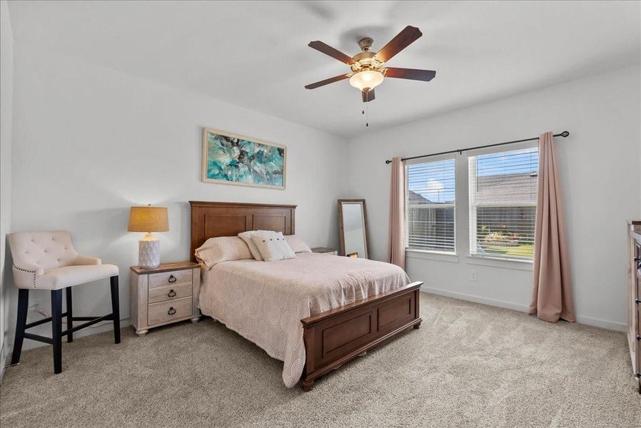 Primary bedroom located on the first floor offers a private en-suite bath