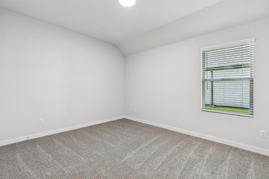 Bedroom in the Oscar home plan by Trophy Signature Homes – REPRESENTATIVE PHOTO