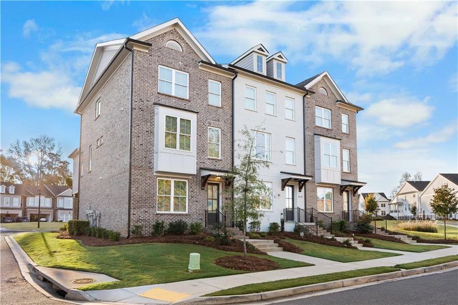 Front exterior of a new home in Brackley Townhomes, Cumming, GA, highlighting curb appeal (Image 23). Front exterior of a new home in Brackley Townhomes, Cumming, GA, highlighting curb appeal (Image 23).