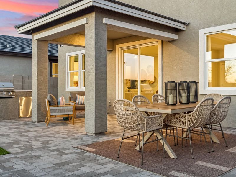 A patio with a table and chairs. A patio with a table and chairs.