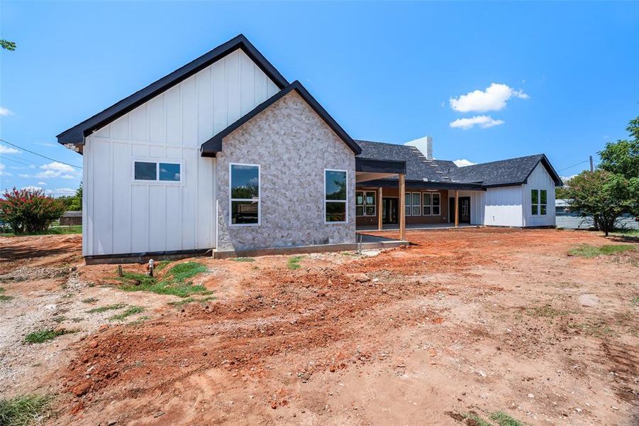 Front exterior of a new home in , Joshua, TX, highlighting curb appeal (Image 1).