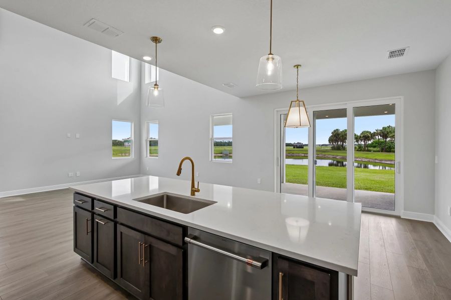 The kitchen also has a stunning view of the pond in the backyard